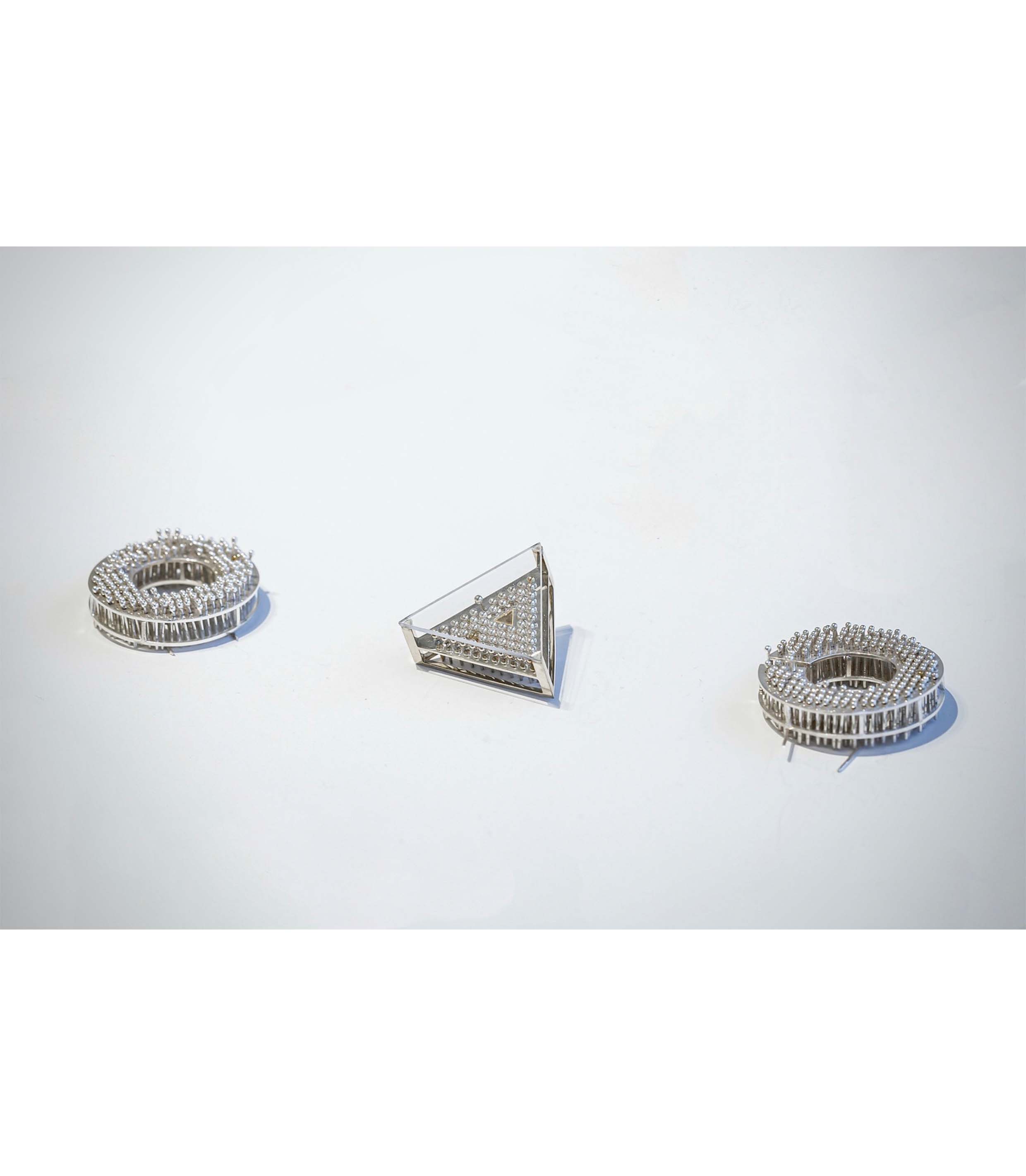 "Less Than One" Brooch Series