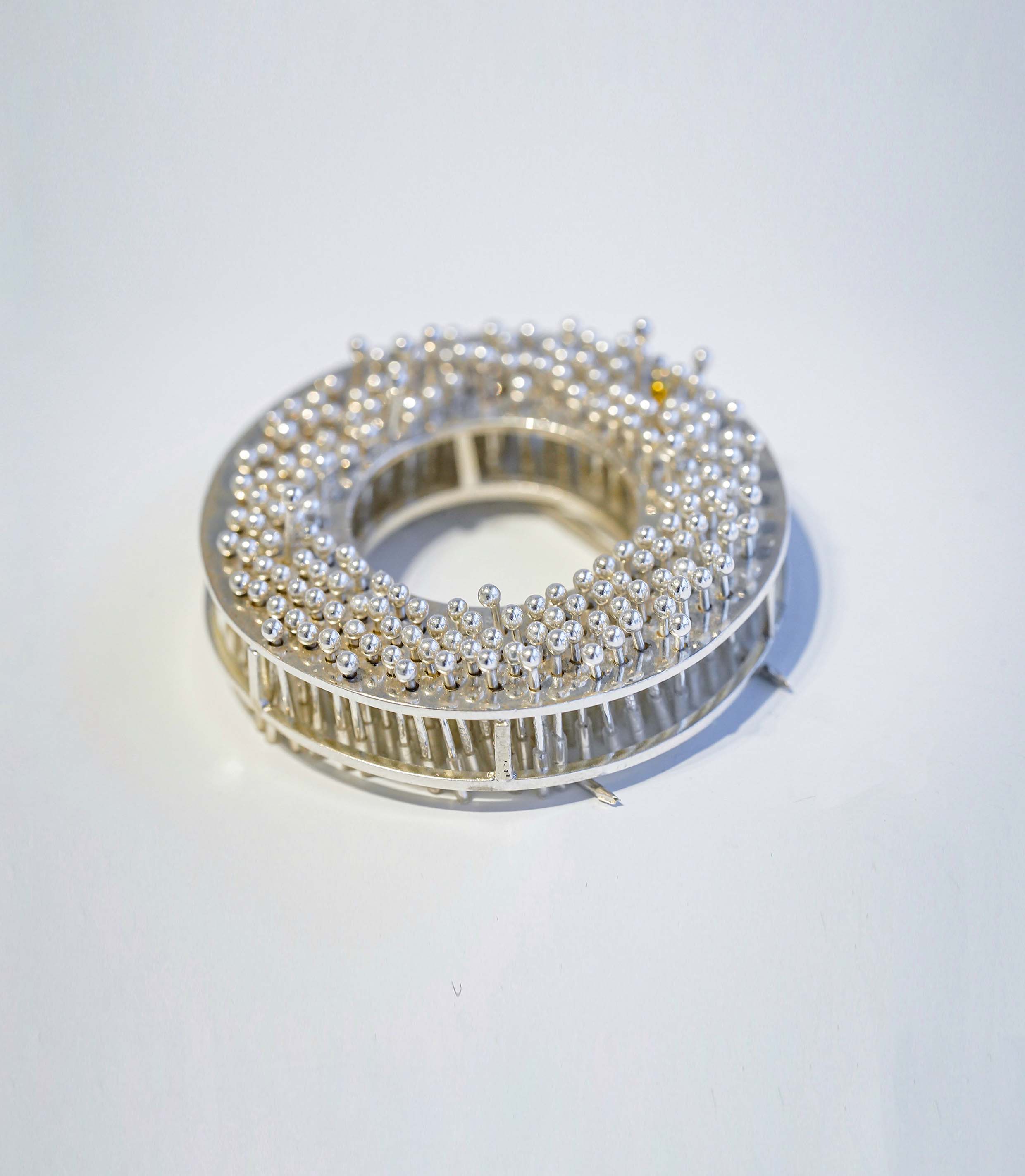 "Less Than One" Brooch Series