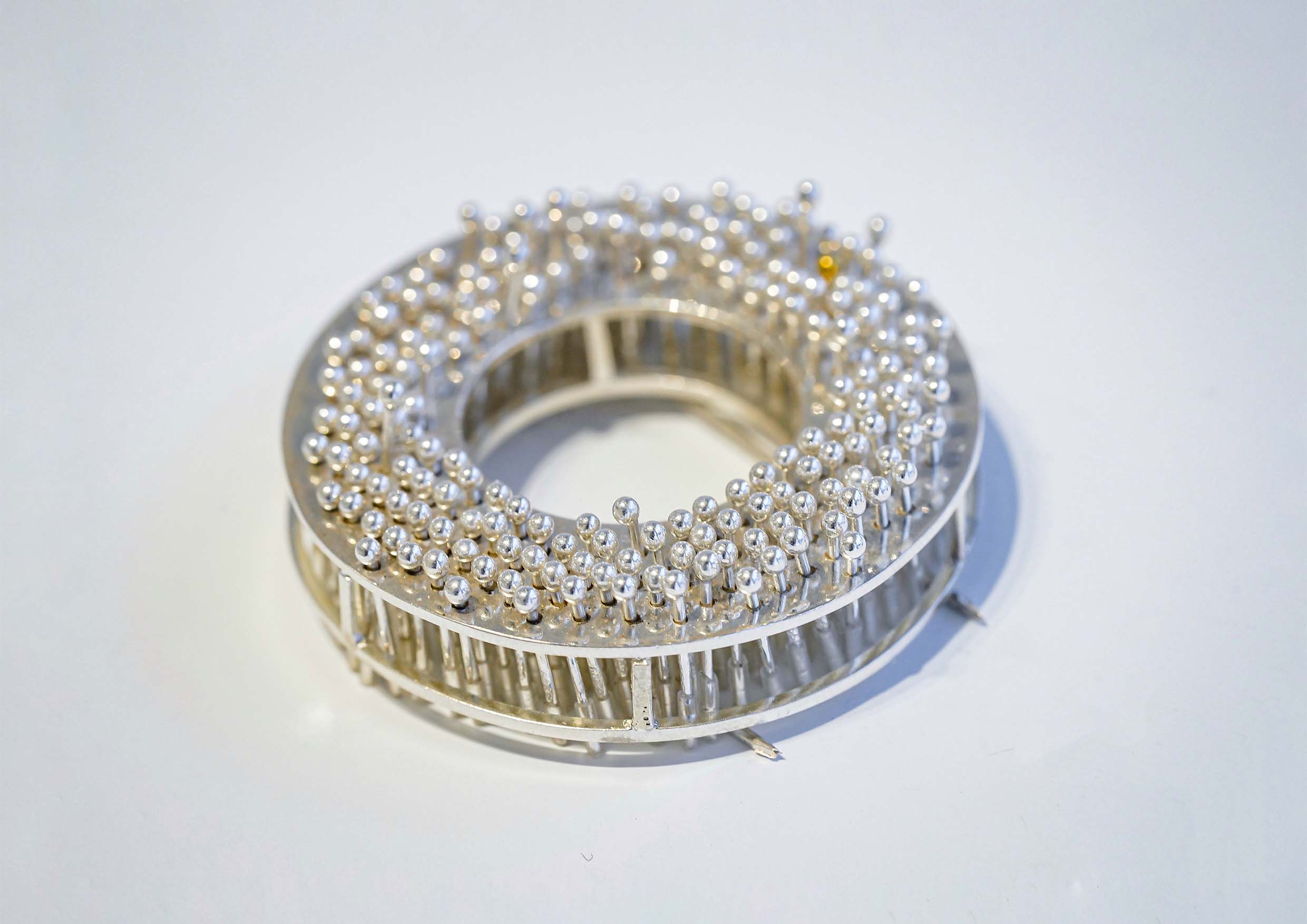 "Less Than One" Brooch Series