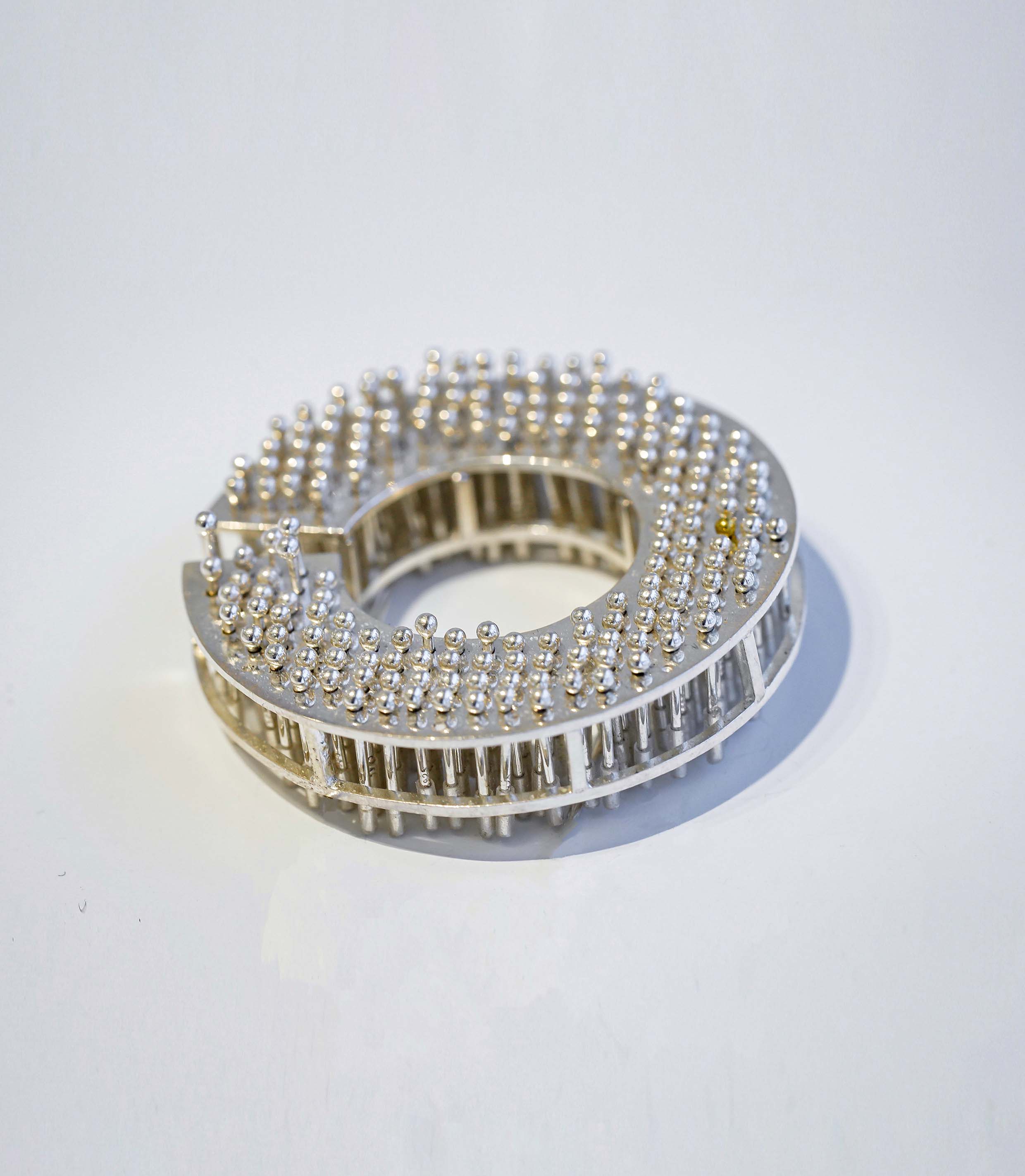 "Less Than One" Brooch Series